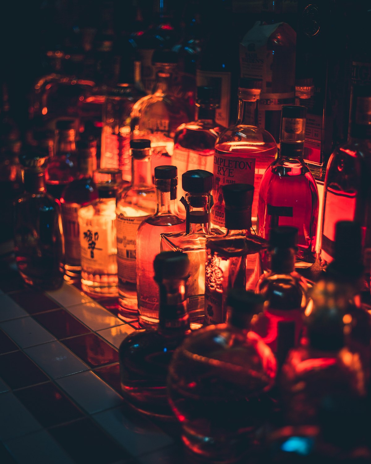 Curated selection of whiskey bottles on a bar